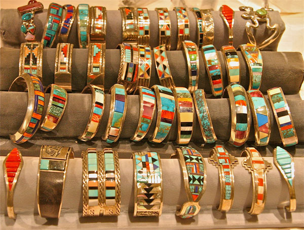 Rows of silver bracelets made by Hopi, Zuni and Navajo artists